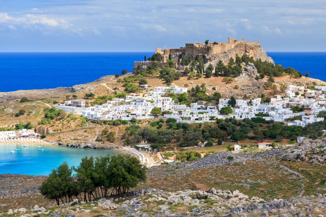 'View from the road down to the popular town of Lindos on the Island of Rhodes Greece' - Rodos